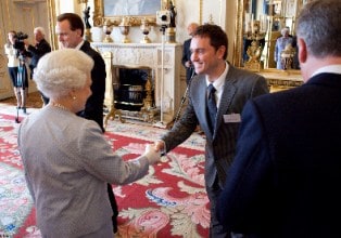 Steve Jackson, chief executive of Recycling Lives, collecting a Queen's Award for Enterprise from Her Majesty the Queen in 2010